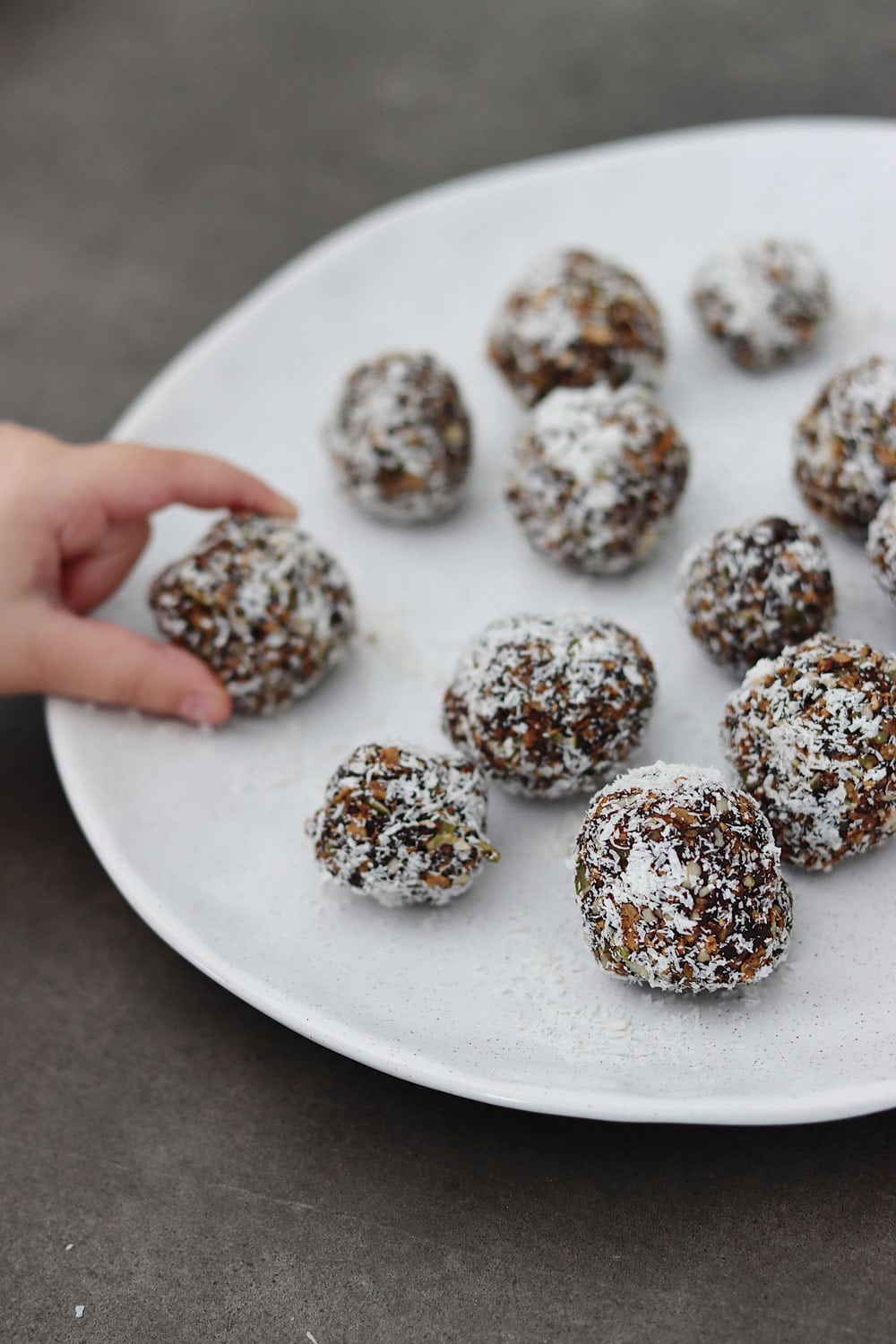 A plate of Chocolate BARLEYmax bliss balls.